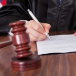 Male Judge Writing On Paper