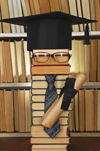 Education concept. Forged student from books in library