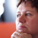 It is portrait of pensive mature woman indoor